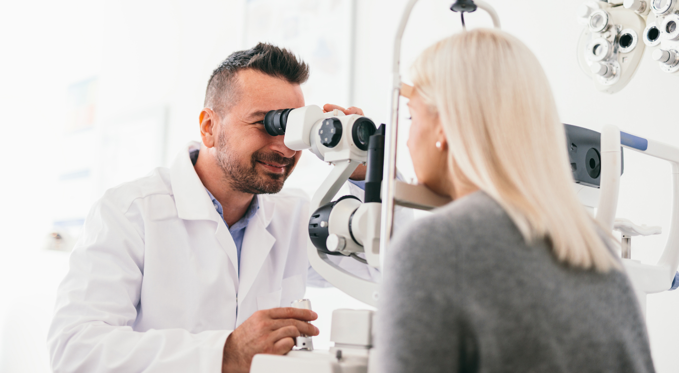 AN eye doctor executing eye exams with the aid of a machine