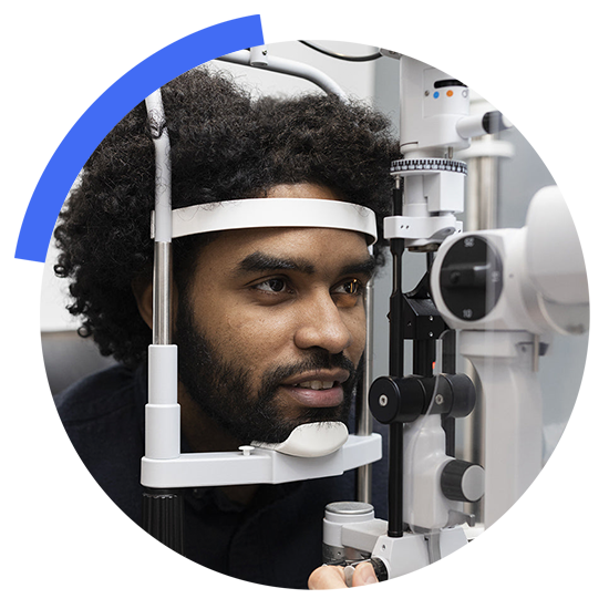 A black man undergoing eye exam