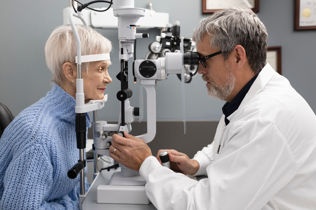 An optometrist using eye technology for an eye test on a female senior