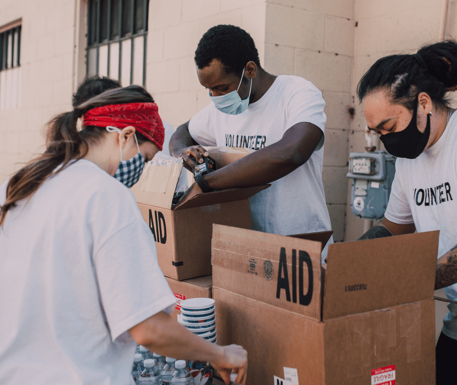 Volunteers actively packaging and arranging donated items