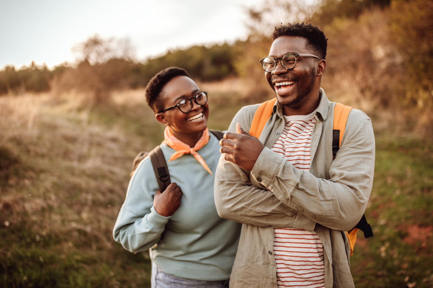 Glasses wearing man and woman in a scanty bush path